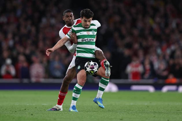 London, England, 15th April 2026. Cristhian Mosquera of Arsenal and Pedro Goncalves of Sporting Lisbon challenge for the ball during the Arsenal vs Sporting Lisbon UEFA Champions League quarter final 2nd leg match at the Emirates Stadium, London. Picture credit should read: David Klein Sportimage EDITORIAL USE ONLY. No use with unauthorised audio, video, data, fixture lists, club league logos or live services. Online in-match use limited to 120 images, no video emulation. No use in betting, games or single club league player publications. SPI_034_DK_Arsenal_Sporting_Lisbon SPI-4686-0034