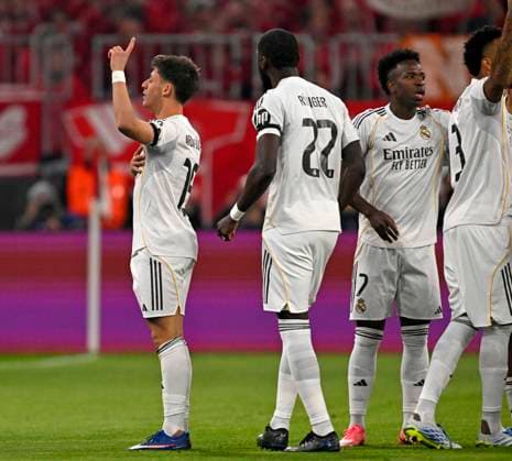 15 04 2026, Football UEFA Championsleague 2025 2026 quarter-final second leg, FC Bayern Munich Real Madrid, in the Allianz Arena Munich, Arda Güler Real Madrid cheers f l Arda Güler Real Madrid , Antonio Rüdiger Real Madrid , Vinicius Junior Real Madrid and Eder Militao Real Madrid DFL and DFB regulations prohibit any use of photographs as image sequences and or quasi video