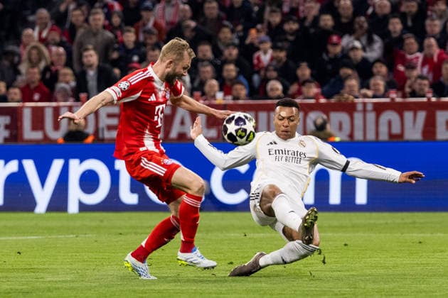 MUNICH, GERMANY - APRIL 15: Kylian Mbappe (Real Madrid, 10) loses the ball to Konrad Laimer (FC Bayern Muenchen, 27) defending during the UEFA Champions League match between FC Bayern Muenchen vs. Real Madrid at Allianz Arena on the second leg of quarter finals of the UEFA Champions League on April 15, 2026 in Munich, Germany. Bavaria Germany Copyright: xSteffiexWunderlx