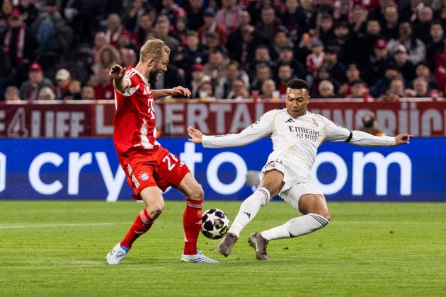 MUNICH, GERMANY - APRIL 15: Kylian Mbappe (Real Madrid, 10) controls the ball against Konrad Laimer (FC Bayern Muenchen, 27) during the UEFA Champions League match between FC Bayern Muenchen vs. Real Madrid at Allianz Arena on the second leg of quarter finals of the UEFA Champions League on April 15, 2026 in Munich, Germany. Bavaria Germany Copyright: xSteffiexWunderlx
