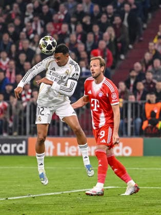 Trent Alexander Arnold Real Madrid and Harry Kane FC Bayern Munich battle for the ball during the UEFA Champions League 2025 26 Quarter Final Second Leg match between FC Bayern Munich and Real Madrid CF at Football Arena Munich on April 15, 2026 in Munich, Germany Photo by Harry Langer DeFodi Images