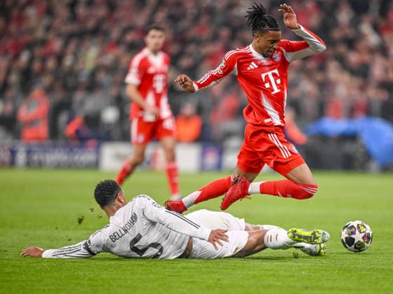 Jude Bellingham Real Madrid and Michael Olise FC Bayern Munich battle for the ball during the UEFA Champions League 2025 26 Quarter Final Second Leg match between FC Bayern Munich and Real Madrid CF at Football Arena Munich on April 15, 2026 in Munich, Germany Photo by Harry Langer DeFodi Images
