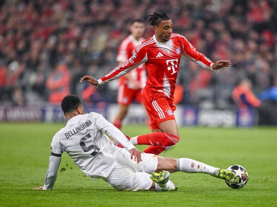 Jude Bellingham Real Madrid and Michael Olise FC Bayern Munich battle for the ball during the UEFA Champions League 2025 26 Quarter Final Second Leg match between FC Bayern Munich and Real Madrid CF at Football Arena Munich on April 15, 2026 in Munich, Germany Photo by Harry Langer DeFodi Images