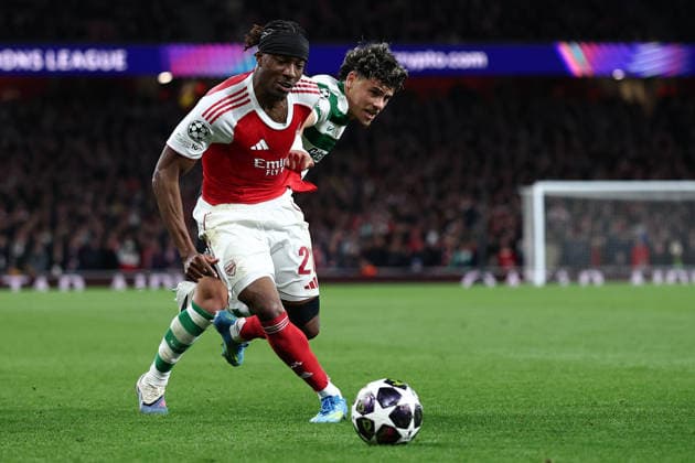 London, England, 15th April 2026. Noni Madueke of Arsenal and Maximiliano Araujo of Sporting Lisbon challenge for the ball during the Arsenal vs Sporting Lisbon UEFA Champions League quarter final 2nd leg match at the Emirates Stadium, London. Picture credit should read: David Klein Sportimage EDITORIAL USE ONLY. No use with unauthorised audio, video, data, fixture lists, club league logos or live services. Online in-match use limited to 120 images, no video emulation. No use in betting, games or single club league player publications. SPI_041_DK_Arsenal_Sporting_Lisbon SPI-4686-0041