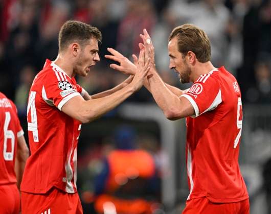 15 04 2026, Football UEFA Championsleague 2025 2026 quarter-final second leg, FC Bayern Munich Real Madrid, in the Allianz Arena Munich, f l Josip Stanisic Bayern Munich and Harry Kane FC Bayern Munich cheer DFL and DFB regulations prohibit any use of photographs as image sequences and or quasi video