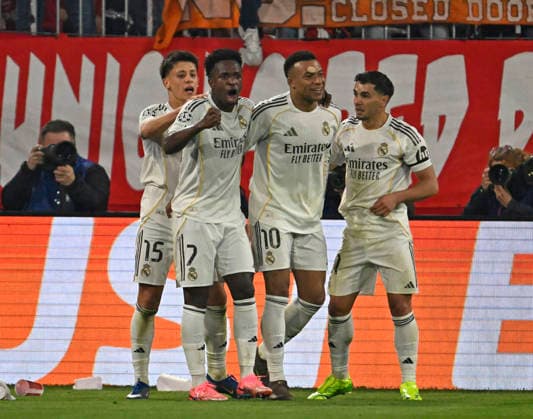 15 04 2026, Football UEFA Championsleague 2025 2026 quarter-final second leg, FC Bayern Munich Real Madrid, in the Allianz Arena Munich, f l Arda Güler Real Madrid , Vinicius Junior Real Madrid , Kylian Mbappe Real Madrid cheer DFL and DFB regulations prohibit any use of photographs as image sequences and or quasi video