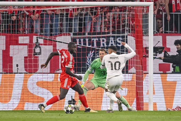 Dayot Upamecano FC Bayern Munich , Goalkeeper Manuel Neuer FC Bayern Munich and Kylian Mbappe Real Madrid battle for the ball during the UEFA Champions League 2025 26 Quarter Final Second Leg match between FC Bayern Munich and Real Madrid CF at Football Arena Munich on April 15, 2026 in Munich, Germany Photo by Harry Langer DeFodi Images