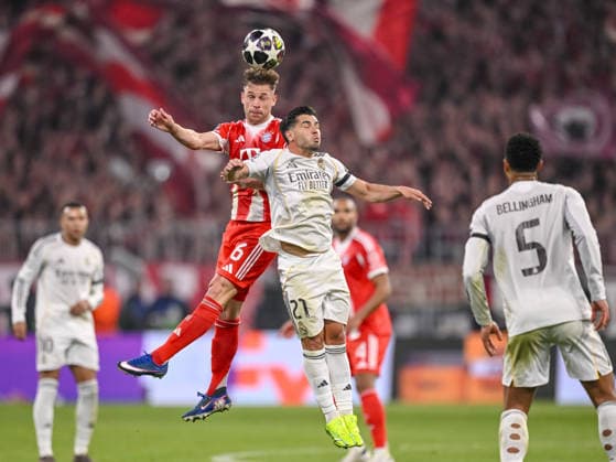 Joshua Kimmich FC Bayern Munich and Brahim Diaz Real Madrid battle for the ball during the UEFA Champions League 2025 26 Quarter Final Second Leg match between FC Bayern Munich and Real Madrid CF at Football Arena Munich on April 15, 2026 in Munich, Germany Photo by Harry Langer DeFodi Images