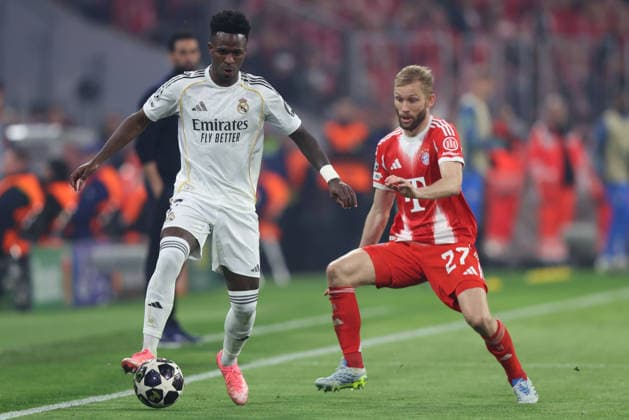 Soccer UEFA Champions League quarter-final second leg FC Bayern Munich Real Madrid on 15 04 2026 at the Allianz Arena in Munich Vinicius Junior Madrid , left Konrad Laimer Munich , right xJRx