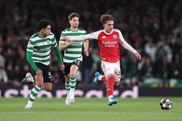 London, England, 15th April 2026. Max Dowman of Arsenal with the ball ahead of Joao Simoes (L) and Daniel Braganca of Sporting Lisbon during the Arsenal vs Sporting Lisbon UEFA Champions League quarter final 2nd leg match at the Emirates Stadium, London. Picture credit should read: David Klein Sportimage EDITORIAL USE ONLY. No use with unauthorised audio, video, data, fixture lists, club league logos or live services. Online in-match use limited to 120 images, no video emulation. No use in betting, games or single club league player publications. SPI_057_DK_Arsenal_Sporting_Lisbon SPI-4686-0057