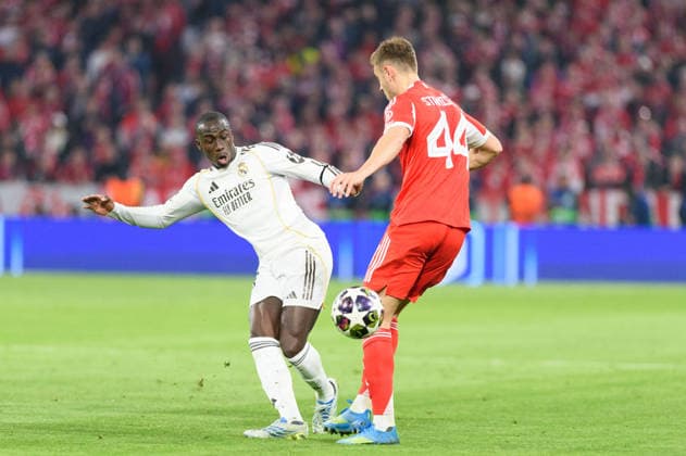 Bayern Munich v Real Madrid UEFA Champions League 2025 26 MUNICH, GERMANY APRIL 15 Ferland Mendy 23 Real Madrid and Josip Stanisic 44 FC Bayern Munich during a UEFA Champions League 2025 26 match between Bayern Munich and Real Madrid in Munich on April 15, 2026 Photo by Sven Beyrich Sports Press Photo Bayern Munich v Real Madrid UEFA Champions League 2025 26 Copyright: xSvenxBeyrich SportsxPressxPhoto x