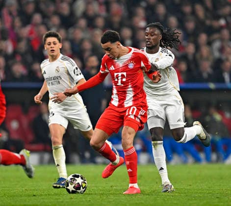 15 04 2026, Football UEFA Championsleague 2025 2026 quarter-final second leg, FC Bayern Munich Real Madrid, at Allianz Arena Munich, v l Jamal Musiala Bayern Munich vs Eduardo Camavinga Real Madrid DFL and DFB regulations prohibit any use of photographs as image sequences and or quasi video