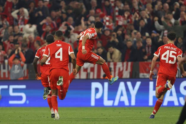 Luis Diaz FC Bayern München celebrates after scoring his team s third goal with teammates during the UEFA Champions League 2025 26 Quarter Final Second Leg match between FC Bayern München and Real Madrid CF at Football Arena Munich on April 15, 2026 in Munich, Germany Photo by Oliver Kaelke DeFodi Images