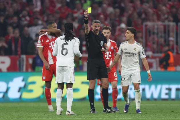 Soccer UEFA Champions League quarter-final second leg FC Bayern Munich Real Madrid on 15 04 2026 at the Allianz Arena in Munich Referee Slavko Vincic Slovenia shows Eduardo Camavinga Madrid the yellow card xJRx
