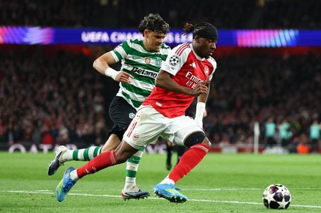 Noni Madueke of Arsenal chased by Maximiliano Araujo of Sporting CP Arsenal v Sporting, UEFA Champions League, Quarter Final, Second Leg, Football, Emirates Stadium, London, UK - 15 Apr 2026London Emirates Stadium United Kingdom EDITORIAL USE ONLY No use with unauthorised audio, video, data, fixture lists, club league logos or live services. Online in-match use limited to 120 images, no video emulation. No use in betting, games or single club league player publications.  Copyright: xSimonxDael Shutterstockx 16828544bi