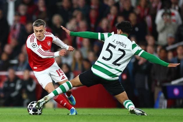 Leandro Trossard of Arsenal tackled by Joao Simoes of Sporting CP Arsenal v Sporting, UEFA Champions League, Quarter Final, Second Leg, Football, Emirates Stadium, London, UK - 15 Apr 2026London Emirates Stadium United Kingdom EDITORIAL USE ONLY No use with unauthorised audio, video, data, fixture lists, club league logos or live services. Online in-match use limited to 120 images, no video emulation. No use in betting, games or single club league player publications.  Copyright: xSimonxDael Shutterstockx 16828544bh