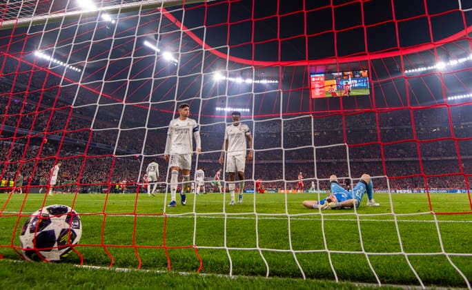 15 04 2026, Football UEFA Championsleague 2025 2026 quarter-final second leg, FC Bayern Munich Real Madrid, in the Allianz Arena Munich, after the goal by Michael Olise FC Bayern Munich goalkeeper Andriy Lunin Real Madrid lies beaten on the ground li Federico Valverde Real Madrid center Eder Militao Real Madrid DFL and DFB regulations prohibit any use of photographs as image sequences and or quasi video