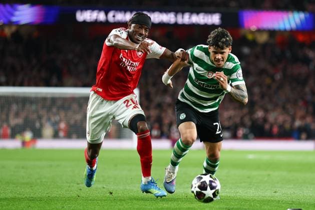 Noni Madueke of Arsenal and Maximiliano Araujo of Sporting CP battle for the ball Arsenal v Sporting, UEFA Champions League, Quarter Final, Second Leg, Football, Emirates Stadium, London, UK - 15 Apr 2026London Emirates Stadium United Kingdom EDITORIAL USE ONLY No use with unauthorised audio, video, data, fixture lists, club league logos or live services. Online in-match use limited to 120 images, no video emulation. No use in betting, games or single club league player publications.  Copyright: xSimonxDael Shutterstockx 16828544dd