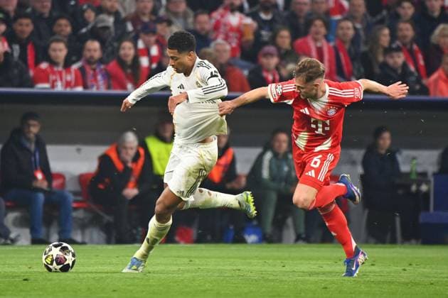 Joshua KIMMICH Bayern Muenchen , action,duel against Jude BELLINGHAM Real Madrid Football Champions League,season 2025 26, quarter-final FC Bayern Muenchen Real Madrid 4 3 on 15 04 2026 A L L I A N Z A R E N A Â