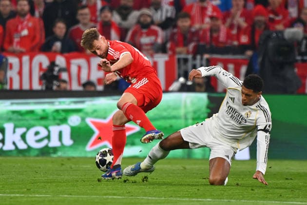Joshua KIMMICH Bayern Muenchen , action,duel against Jude BELLINGHAM Real Madrid Football Champions League,season 2025 26, quarter-final FC Bayern Muenchen Real Madrid 4 3 on 15 04 2026 A L L I A N Z A R E N A