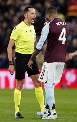 Birmingham, England, 16th April 2026. Referee Jose Maria Sanchez taks to Ezri Konsa of Aston Villa during the Aston Villa vs Bologna UEFA Europa League quarter final 2nd leg match at Villa Park, Birmingham. Picture credit should read: Andrew Yates Sportimage EDITORIAL USE ONLY. No use with unauthorised audio, video, data, fixture lists, club league logos or live services. Online in-match use limited to 120 images, no video emulation. No use in betting, games or single club league player publications. SPI_027_AY_Villa_Bologna SPI-4689-0025