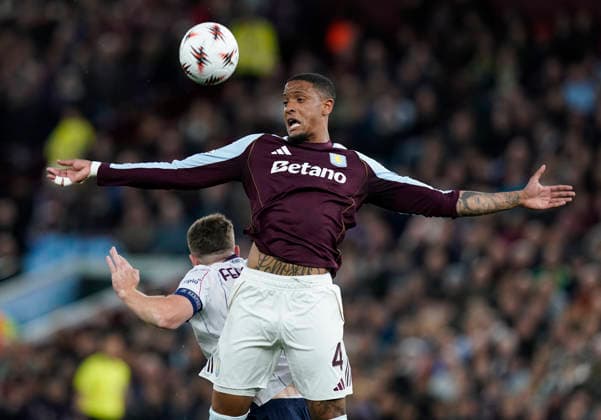 Birmingham, England, 16th April 2026. Ezri Konsa of Aston Villa tussles with Bologna s Lewis Ferguson during the Aston Villa vs Bologna UEFA Europa League quarter final 2nd leg match at Villa Park, Birmingham. Picture credit should read: Andrew Yates Sportimage EDITORIAL USE ONLY. No use with unauthorised audio, video, data, fixture lists, club league logos or live services. Online in-match use limited to 120 images, no video emulation. No use in betting, games or single club league player publications. SPI_030_AY_Villa_Bologna SPI-4689-0029