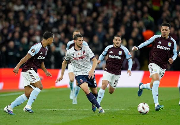 Birmingham, England, 16th April 2026. Bologna s Remo Freuler in action with Morgan Rogers of Aston Villa during the Aston Villa vs Bologna UEFA Europa League quarter final 2nd leg match at Villa Park, Birmingham. Picture credit should read: Andrew Yates Sportimage EDITORIAL USE ONLY. No use with unauthorised audio, video, data, fixture lists, club league logos or live services. Online in-match use limited to 120 images, no video emulation. No use in betting, games or single club league player publications. SPI_042_AY_Villa_Bologna SPI-4689-0042