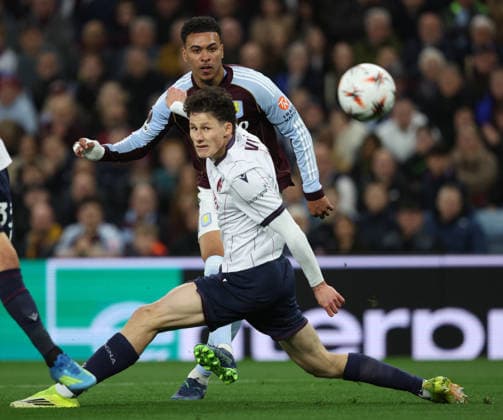 Aston Villa FC v Bologna FC 1909 - UEFA Europa League 2025 26 Quarter-Final Leg Two Morgan Rogers of Aston Villa and Martin Vitik of Bologna challenge during the UEFA Europa League 2025 26 Quarter-Final Leg Two match between Aston Villa FC and Bologna FC 1909 at Villa Park on April 16, 2026 in Birmingham, England. WARNING! This Photograph May Only Be Used For Newspaper And Or Magazine Editorial Purposes. May Not Be Used For Publications Involving 1 player, 1 Club Or 1 Competition Without Written Authorisation From Football DataCo Ltd. For Any Queries, Please Contact Football DataCo Ltd on +44 (0) 207 864 9121 Birmingham Villa Park England United Kingdom Copyright: xAllstarxPicturexLibraryxLtdx