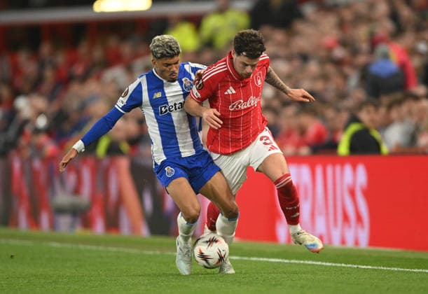 Nottingham, England, 16th April 2026. William Gomes of FC Porto tackles Neco Williams of Nottingham Forest during the Nottingham Forest vs FC Porto UEFA Europa League quarter final 2nd leg match at the City Ground, Nottingham. Picture credit should read: Harriet Massey Sportimage EDITORIAL USE ONLY. No use with unauthorised audio, video, data, fixture lists, club league logos or live services. Online in-match use limited to 120 images, no video emulation. No use in betting, games or single club league player publications. SPI_037_FOREST_V_PORTO SPI-4690-0040
