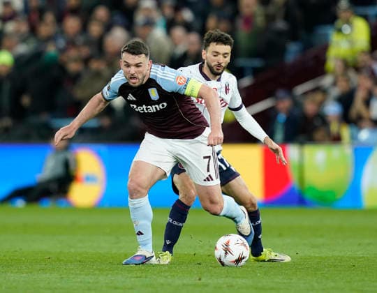 Birmingham, England, 16th April 2026. John McGinn of Aston Villa tussles with Bologna s Joao Mario during the Aston Villa vs Bologna UEFA Europa League quarter final 2nd leg match at Villa Park, Birmingham. Picture credit should read: Andrew Yates Sportimage EDITORIAL USE ONLY. No use with unauthorised audio, video, data, fixture lists, club league logos or live services. Online in-match use limited to 120 images, no video emulation. No use in betting, games or single club league player publications. SPI_047_AY_Villa_Bologna SPI-4689-0047