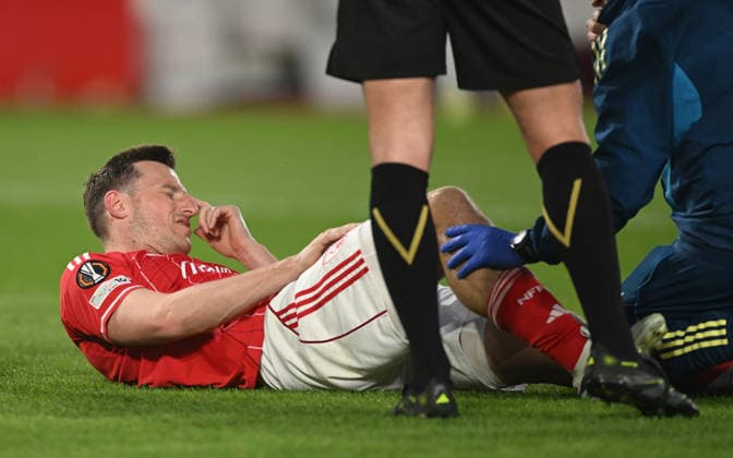Nottingham, England, 16th April 2026. Chris Wood of Nottingham Forest injured during the Nottingham Forest vs FC Porto UEFA Europa League quarter final 2nd leg match at the City Ground, Nottingham. Picture credit should read: Harriet Massey Sportimage EDITORIAL USE ONLY. No use with unauthorised audio, video, data, fixture lists, club league logos or live services. Online in-match use limited to 120 images, no video emulation. No use in betting, games or single club league player publications. SPI_040_FOREST_V_PORTO SPI-4690-0042