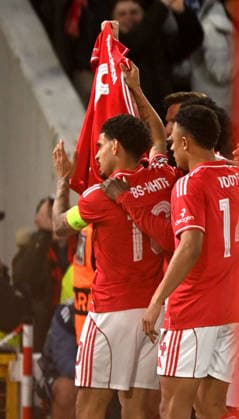 Nottingham, England, 16th April 2026. Morgan Gibbs White of Nottingham Forest celebrates the first goal and holds up a shirt supporting Elliott Anderson after the death of his mother during the Nottingham Forest vs FC Porto UEFA Europa League quarter final 2nd leg match at the City Ground, Nottingham. Picture credit should read: Harriet Massey Sportimage EDITORIAL USE ONLY. No use with unauthorised audio, video, data, fixture lists, club league logos or live services. Online in-match use limited to 120 images, no video emulation. No use in betting, games or single club league player publications. SPI_041_FOREST_V_PORTO SPI-4690-0045