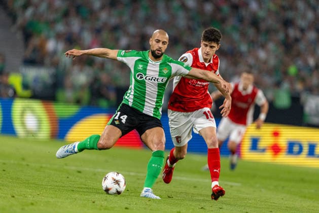 Sofyan Amrabat (14) and Pau Victor (18) seen during UEFA Europa League quarterfinal game between teams of Real Betis Balompie and SC Braga (Maciej Rogowski Ball Raw Images) Sevilla Estadio La Cartuja Spain Copyright: xMaciejxRogowskix ROG_RBvBRA-120