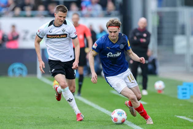 Fabian Kunze 1 FC Kaiserslautern and Jonas Therkelsen Holstein Kiel battle for the ball, 2 Bundesliga, Holstein Kiel v 1 FC Kaiserslautern, Holstein Stadion on April 17, 2026 in Kiel, Germany Photo by Marco Steinbrenner DeFodi Images Fabian Kunze 1 FC Kaiserslautern and Jonas Therkelsen Holstein Kiel battle for the ball, 2 Bundesliga, Holstein Kiel v 1 FC Kaiserslautern, Holstein Stadion, April 17, 2026 in Kiel, Germany Photo by Marco Steinbrenner DeFodi Images