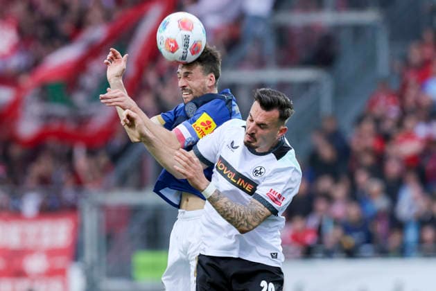 Jonas Meffert Holstein Kiel and Mergim Berisha 1 FC Kaiserslautern battle for the ball, 2 Bundesliga, Holstein Kiel v 1 FC Kaiserslautern, Holstein Stadion on April 17, 2026 in Kiel, Germany Photo by Marco Steinbrenner DeFodi Images Jonas Meffert Holstein Kiel and Mergim Berisha 1 FC Kaiserslautern battle for the ball, 2 Bundesliga, Holstein Kiel v 1 FC Kaiserslautern, Holstein Stadion, April 17, 2026 in Kiel, Germany Photo by Marco Steinbrenner DeFodi Images