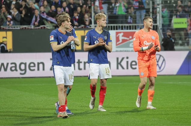 Jonas Therkelsen Holstein Kiel , Frederik Roslyng Holstein Kiel , Goalkeeper Timon Weiner Holstein Kiel after final whistle Football, Men, Season 2025 2026, 2 BL, Holstein Stadion, Holstein Kiel vs 1 FC Kaiserslautern, 3 0 DFL REGULATIONS PROHIBIT ANY USE OF PHOTOGRAPHS AS IMAGE SEQUENCES AND OR QUASI VIDEO