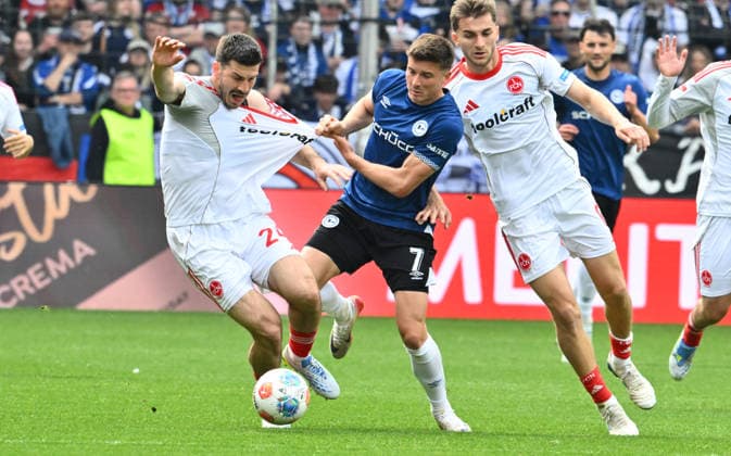 18 04 2026 Soccer Season 2025 2026 2 Soccer Bundesliga 30 Matchday DSC Arminia Bielefeld 1 FC Nürnberg FCN Club Sportfoto Zink xwoxzix DFL regulations prohibit any use of photographs as image sequences and or quasi video only for editorial use Luka Lochoshvili 24, 1 FC Nürnberg FCN Semir Telalovic 7, Arminia Bielefeld Adam Markhiev 6, 1 FC Nürnberg FCN