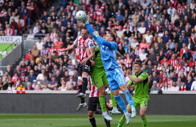 Brentford v Fulham, Premier League, Football, Gtech Community Stadium, Brentford, London, UK - 18 Apr 2026 Goalkeeper Bernd Leno of Fulham punches the ball away from a challenge from Mikkel Damsgaard of Brentford London Gtech Community Stadium Brentford UK, UK NEWSPAPERS OUT Copyright: xSeanxRyanx