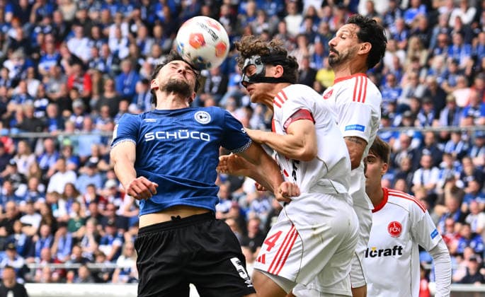18 04 2026 Soccer Season 2025 2026 2 Soccer Bundesliga 30 Matchday DSC Arminia Bielefeld 1 FC Nürnberg FCN Club Sportfoto Zink xwoxzix DFL regulations prohibit any use of photographs as image sequences and or quasi video only for editorial use Maximilian Bauer 5, Arminia Bielefeld Fabio Gruber 4, 1 FC Nürnberg FCN Adriano Grimaldi 33, 1 FC Nürnberg FCN