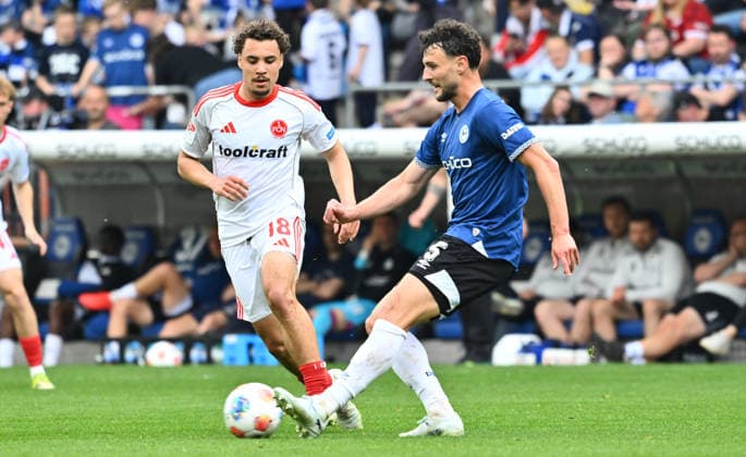 18 04 2026 Soccer Season 2025 2026 2 Soccer Bundesliga 30 Matchday DSC Arminia Bielefeld 1 FC Nürnberg FCN Club Sportfoto Zink xwoxzix DFL regulations prohibit any use of photographs as image sequences and or quasi video only for editorial use Rafael Lubach 18, 1 FC Nürnberg FCN Maximilian Bauer 5, Arminia Bielefeld
