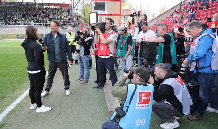 Coach Marie Louise Eta in an interview, Media Photographers Cameras Sports Football Soccer Bundesliga Men DFL 30 Matchday Season 2025 2026 18 04 2026 1 FC Union Berlin FCU vs VfL Wolfsburg WOB DFL regulations prohibit any use of photographs as image sequences and or quasi video