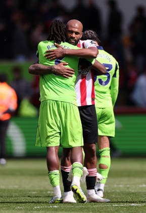 London, England, 18th April 2026. Igor Thiago of Brentford hugs Calvin Bassey of Fulham at the final whistle during the Brentford vs Fulham Premier League match at Gtech Community Stadium, London. Picture credit should read: David Klein Sportimage EDITORIAL USE ONLY. No use with unauthorised audio, video, data, fixture lists, club league logos or live services. Online in-match use limited to 120 images, no video emulation. No use in betting, games or single club league player publications. SPI_DK_037_Brentford_Fulham SPI-4698-0037