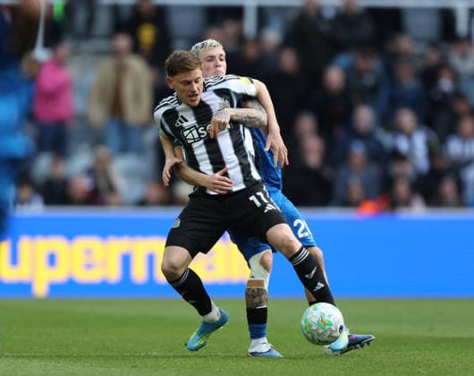 Newcastle Upon Tyne, England, 18th April 2026. Harvey Barnes (L) of Newcastle United in action with Alex Jiminez of AFC Bournemouth during the Newcastle United vs AFC Bournemouth Premier League match at St. James Park, Newcastle Upon Tyne. Picture credit should read: Nigel Roddis Sportimage EDITORIAL USE ONLY. No use with unauthorised audio, video, data, fixture lists, club league logos or live services. Online in-match use limited to 120 images, no video emulation. No use in betting, games or single club league player publications. SPI_029_NR_NEWC_BOUR SPI-4699-0028