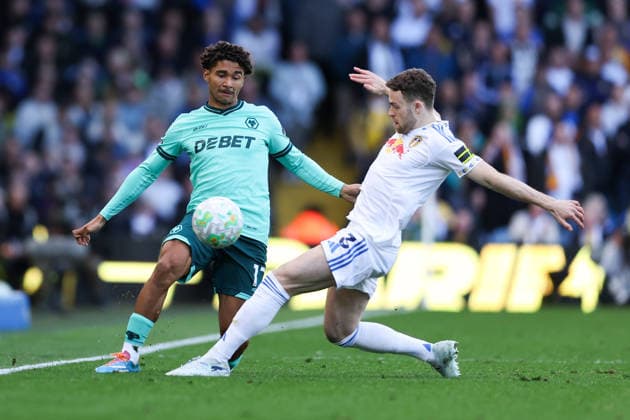 Leeds, England, 18th April 2026. Pedro Lima of Wolverhampton Wanderers is challenged by Gabriel Gudmundsson of Leeds United during the Leeds United vs Wolverhampton Wanderers Premier League match at Elland Road, Leeds. Picture credit should read: Jessica Hornby Sportimage EDITORIAL USE ONLY. No use with unauthorised audio, video, data, fixture lists, club league logos or live services. Online in-match use limited to 120 images, no video emulation. No use in betting, games or single club league player publications. SPI_044_JH_LEEDS_UNITED_WOLVES SPI-4700-0044