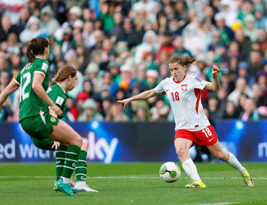 18th April 2026; Aviva Stadium, Dublin, Ireland; 2026 Womens World Cup Qualifier Football, Republic of Ireland versus Poland; Nadia Krezyman of Poland makes a run with the ball covered by Patten of Ireland PeterxFitzpatrick