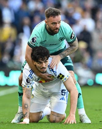 Adam Armstrong of Wolverhampton Wanderers piggy backs Pascal Struijk of Leeds United Leeds United v Wolverhampton Wanderers, Premier League, Football, Elland Road, Leeds, UK - 18 Apr 2026Leeds Elland Road United Kingdom EDITORIAL USE ONLY No use with unauthorised audio, video, data, fixture lists, club league logos or live services. Online in-match use limited to 120 images, no video emulation. No use in betting, games or single club league player publications. Copyright: xGreigxCowie Shutterstockx 16832140ai