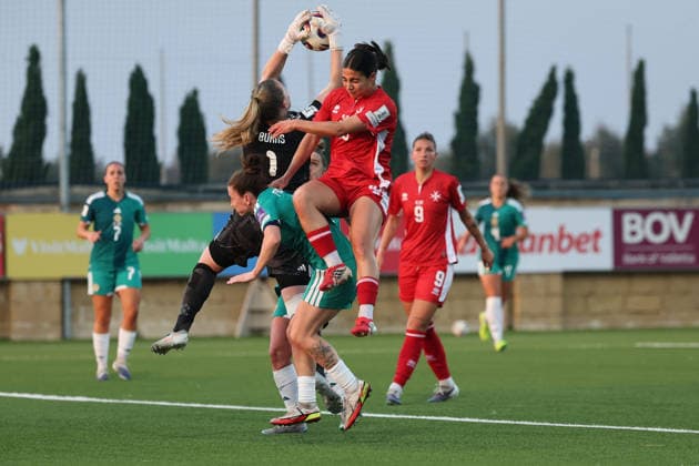 Jacqueline Burns (top, left), goalkeeper of Northern Ireland is in action against Maria Farrugia of Malta during the FIFA Women™s World Cup 2027 European qualifiers League B, Group B2 soccer match between Malta and Nothern Ireland at the Centenary Stadium, Ta™ Qali, Malta on 18 April 2026. Women™s European Qualifiers - Malta v Northern Ireland