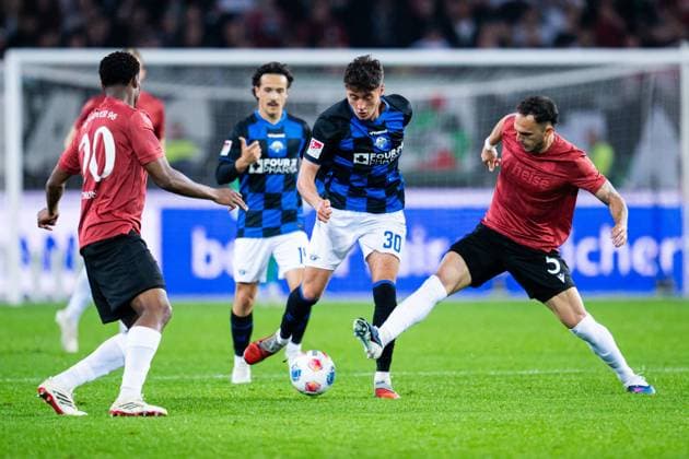 18 04 2026 Soccer, 2025 2026, 2 Bundesliga, Matchday 30, Hannover 96 SC Paderborn 07 L R Ime Okon Hannover , Stefano Marino Paderborn , Ime Okon Hannover DFL REGULATIONS PROHIBIT ANY USE OF PHOTOGRAPHS AS IMAGE SEQUENCES AND OR QUASI VIDEO