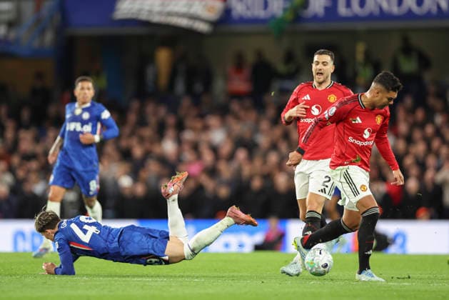 Chelsea v Manchester United, ManU Premier League Chelsea forward Alejandro Garnacho (49) tackled by Manchester United midfielder Casemiro (18) and Manchester United defender Diogo Dalot (2) during the Chelsea v Manchester United Premier League match at Stamford Bridge, London, England on 18 April 2026 Credit: Phil Duncan Every Second Media Editorial use only. All images are copyright Every Second Media Limited. No images may be reproduced without prior permission. All rights reserved. Premier League and Football League images are subject to licensing agreements with Football DataCo Limited. see https: www.football-dataco.com Copyright: xIMAGO EveryxSecondxMediax ESM-1917-0039 PhilxDuncanx xEveryxSecondxMediax