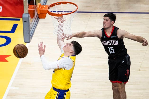 April 18, 2026, Los Angeles, California, USA: Los Angeles LakersÃ¢â‚¬â ¢ Jake LaRavia (12) goes to the basket under pressure from Houston RocketsÃ¢â‚¬â ¢ Reed Sheppard (15) during Game 1 of a first-round NBA, Basketball Herren, USA playoff series at Crypto.com Arena on Saturday, April 18, 2026 in Los Angeles. Los Angeles USA - ZUMAc68_ 20260418_zaf_c68_069 Copyright: xRingoxChiux
